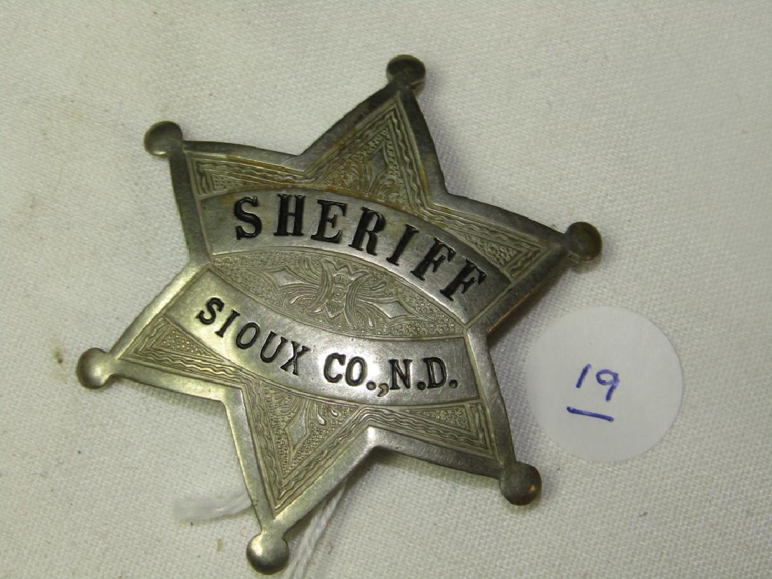 Badge: Sheriff Sioux Co. N.D. badge, 6 point star
