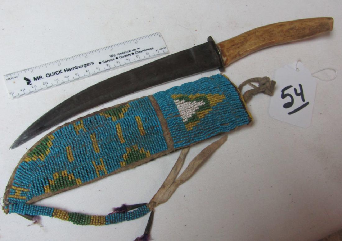 Plains knife case: Plains 9" beaded knife case with knife, bead tassel, cones, Good cond. Ca. 1890