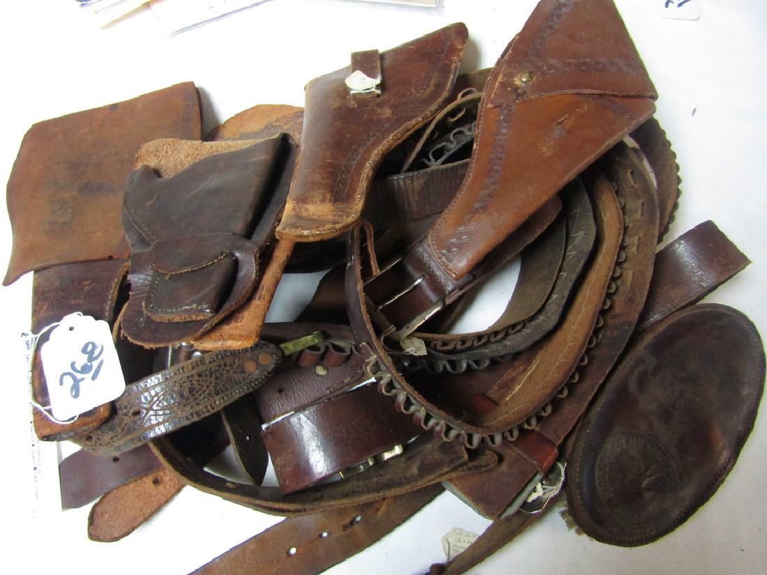 Belts/Holsters: 7 old cartridge belts, 4 old holsters and brush