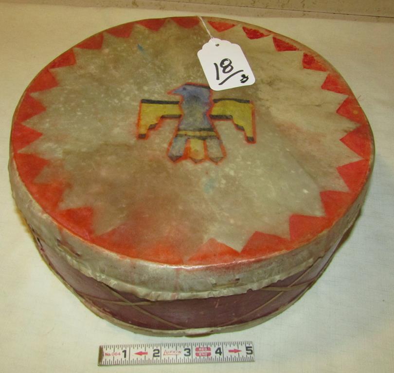 Drum: Menominee rawhide and wood drum, 12" x 4 1/2", painted Thunderbird, small tear on back side, Fair/good cond. ca. 1900