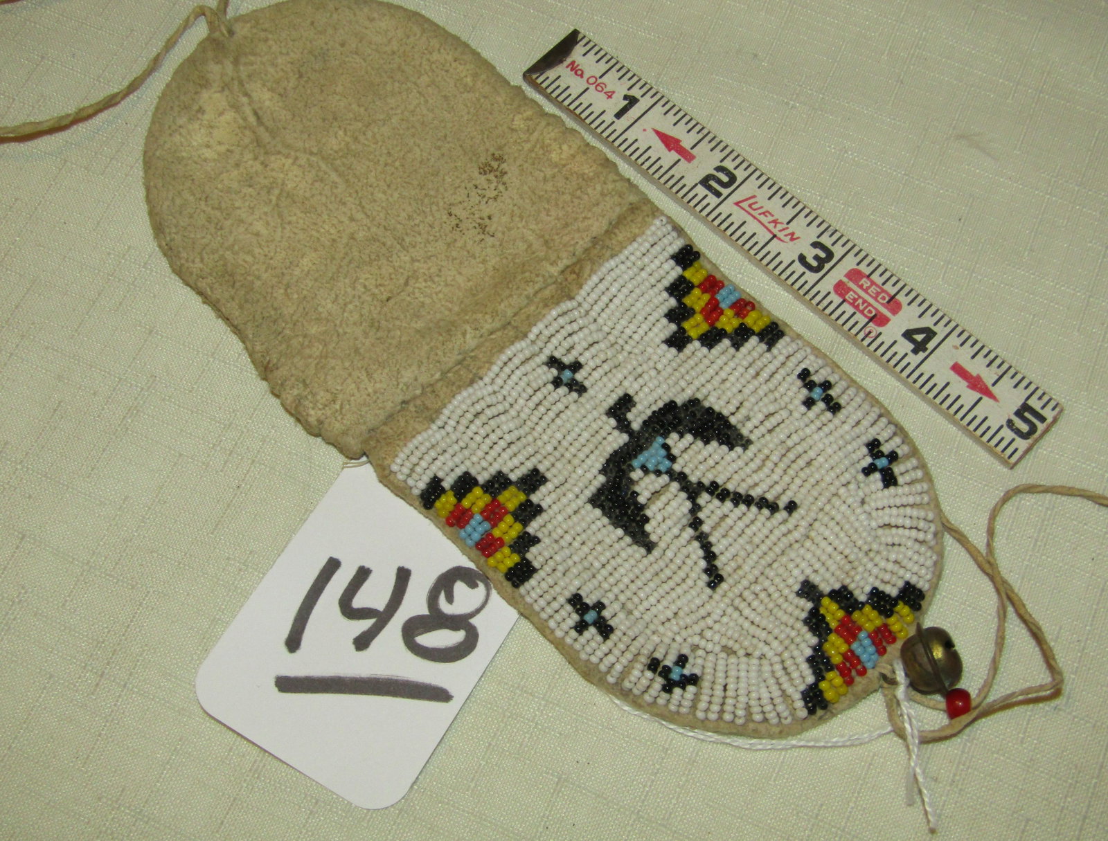 Cheyenne pouch: Cheyenne beaded hide flap pouch, 4", Thunderbird design, sinew sewn, good/very good cond.