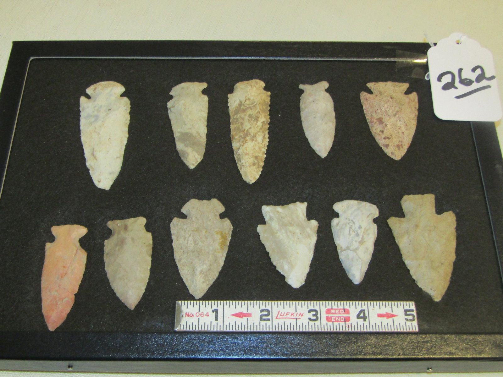 11 points: Frame with 11 various flint points and older southwest bolo