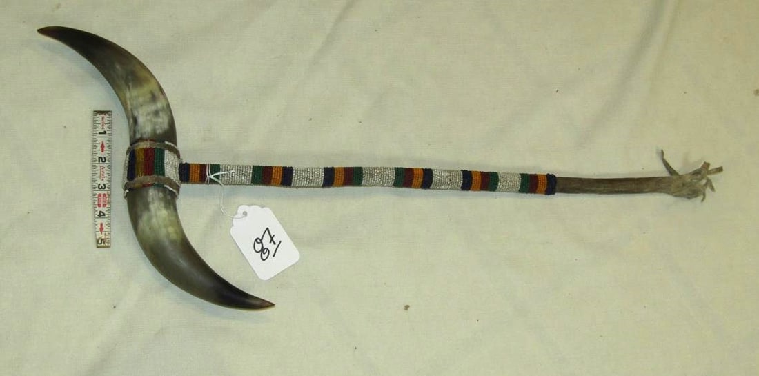 Dance pc: Plains 25" horn ceremonial dance pc, bead handle, sinew, good cond. Ca. 1900