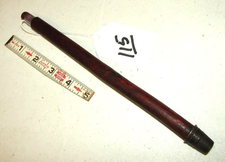 Pipe stem: 10" wood red ochred pipe stem with thimble end, good cond. 19th century