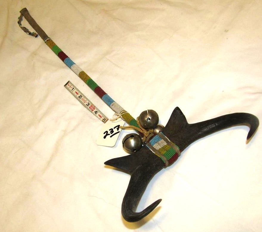 Dance pc: Plains ceremonial horn dance pc, 24" plus bead tassel, partial sinew sewn, bells, very good cond. early 20th