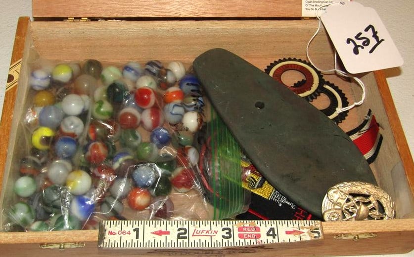 Misc items: Wood cigar box with marbles, 6 3/4" slate gorget, badge etc