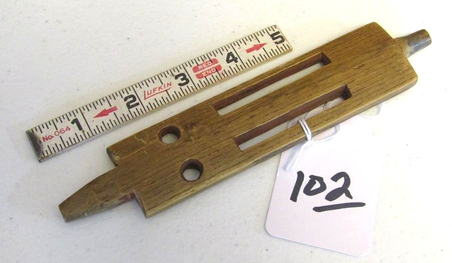 Pipe stem: Sioux 7 1/2" wood carved puzzle pipe stem, red oche in holes,