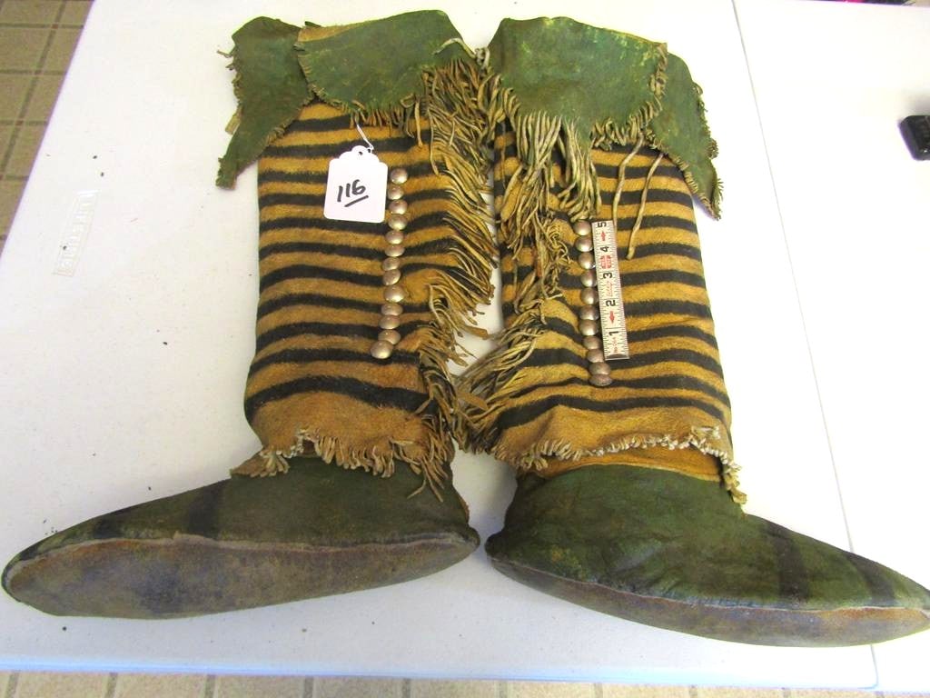 Moccasins: Comanche 18" high top 10"moccasins, silver buttons, green ochre, black circles stated coup marks, fringed cuffs, good cond, Rare