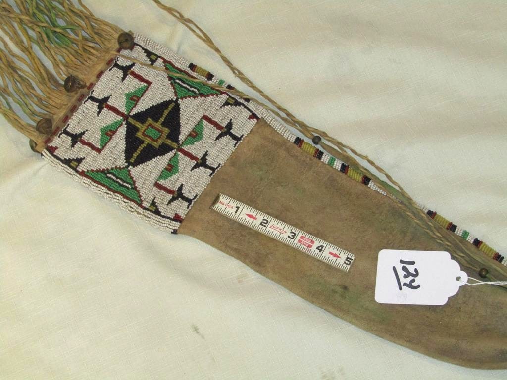 Pipe bag,: Northern Plains beaded pipe bag, 5 3/4" x 21" plus long hide fringe, bells, traces of green ochre, sinew sewn, good/very good condition