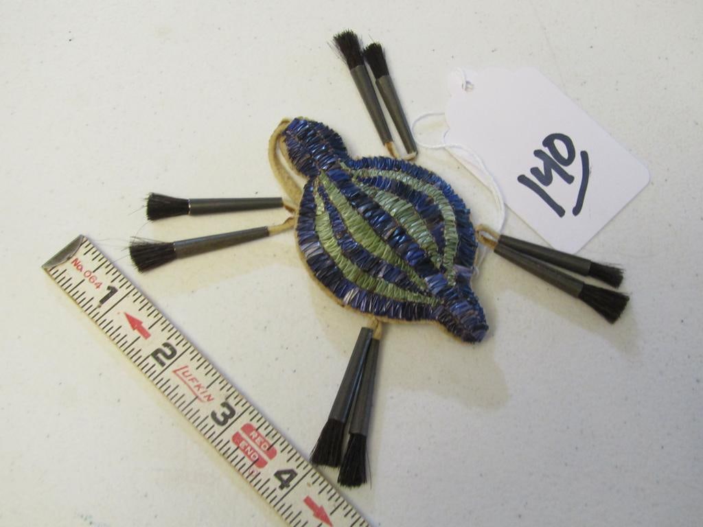 Amulet: Sioux 3 3/4" quilled turtle amulet, cones, sinew sewn, owner states for hanging on cradle board, hide wrapping, good condition