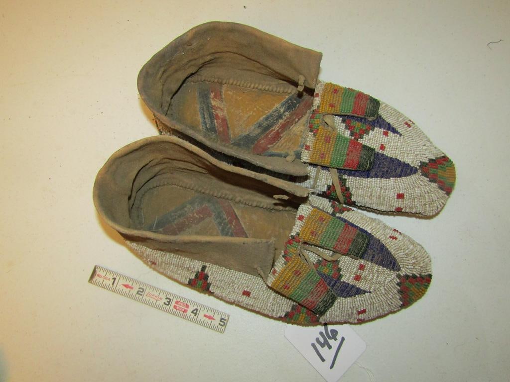 Moccasins: Cheyrenne 11" full beaded moccasins with parfletch soles, bead tabs, sinew sewn good condition