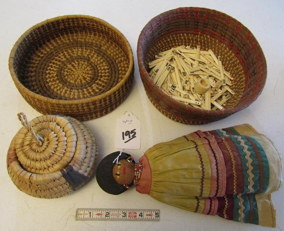 4 pc misc: 4 pc misc items, 2 baskets one with game pcs and dice, small basket and 10" Seminole Indian doll