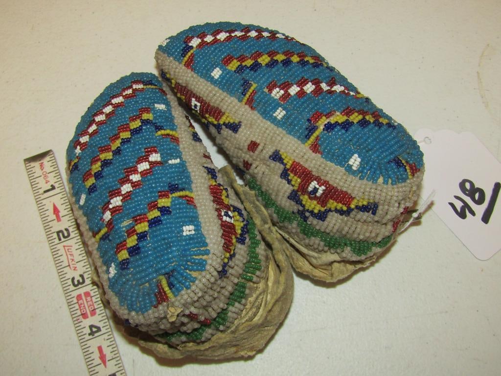 Moccasins: Plains fully beaded 5 3/4" child's ceremonial moccasins, sinew sewn, missing one cuff