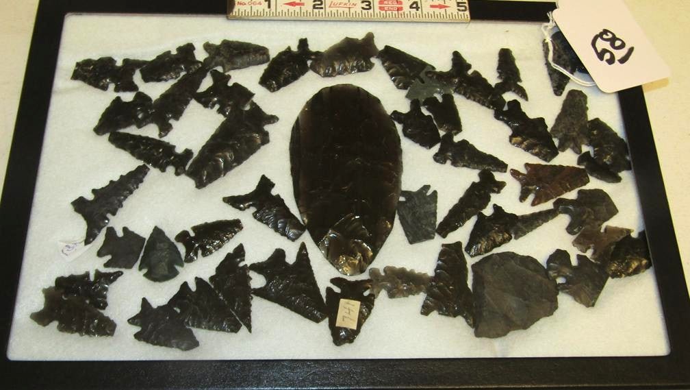 Numerous points: Display with numerous obsidian points (most broken) plus 4 1/4" blade