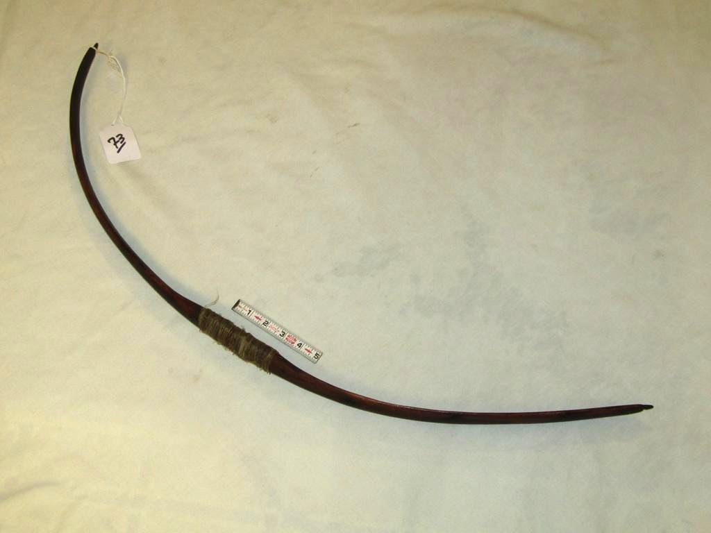 Bow: Comanche 35" osage orange bow with sinew wrap and info tag, good cond