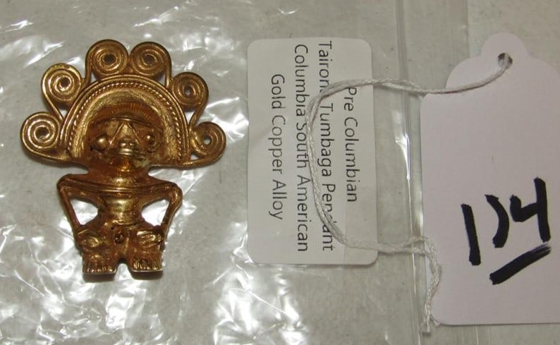 Penda=nt: Bag with 2 1/4" pre-columbian marked gold copper alloy pendant, very good cond