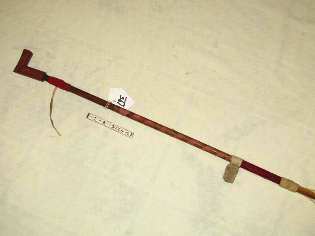 Pipe: Northern Plains 32" pipe with 3 1/2" catlinite pipe bowl, ribbon wrapped and cloth decorated stem, horse hair, good cond