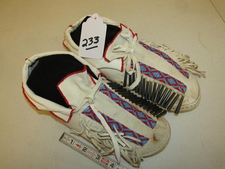 Moccasins: Southern Plains later 11" beaded moccasins, fringe, tin cones, sinew sewn, good cond