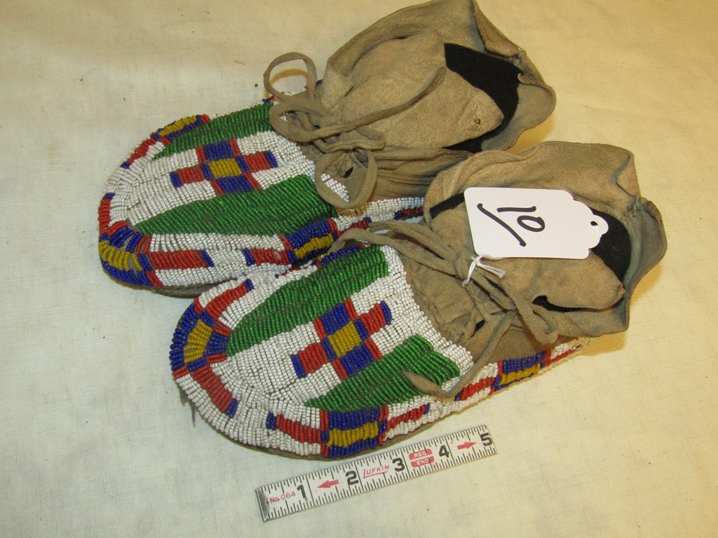 Moccasins: Sioux 10 1/2" fully beaded moccasins, sinew sewn, holes in soles, fair condition