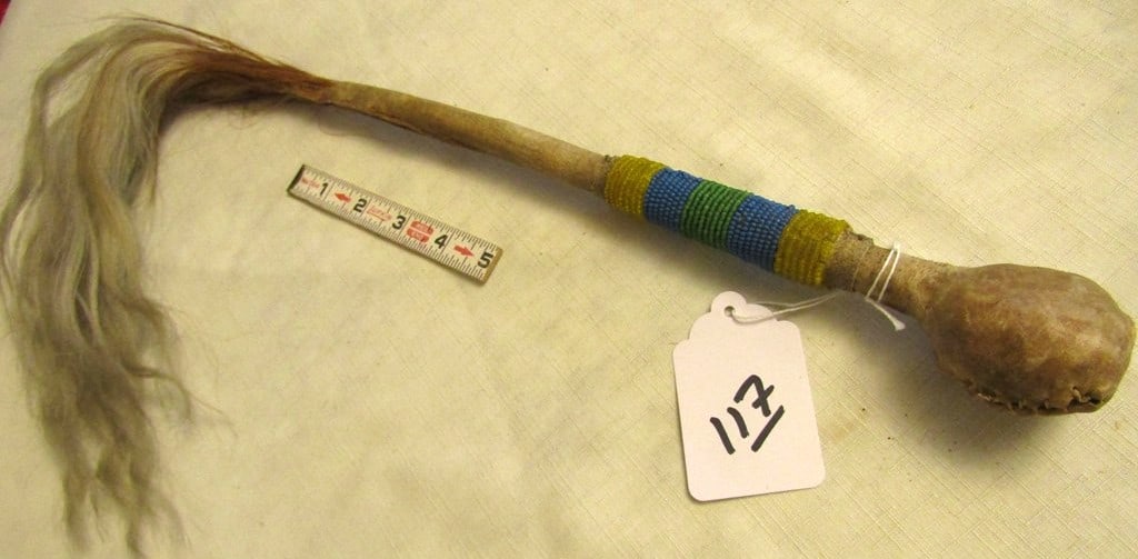 War club: Northern plains 15" sinew sewn stone head war club, bead handle and long horsehair tassel, good condition,