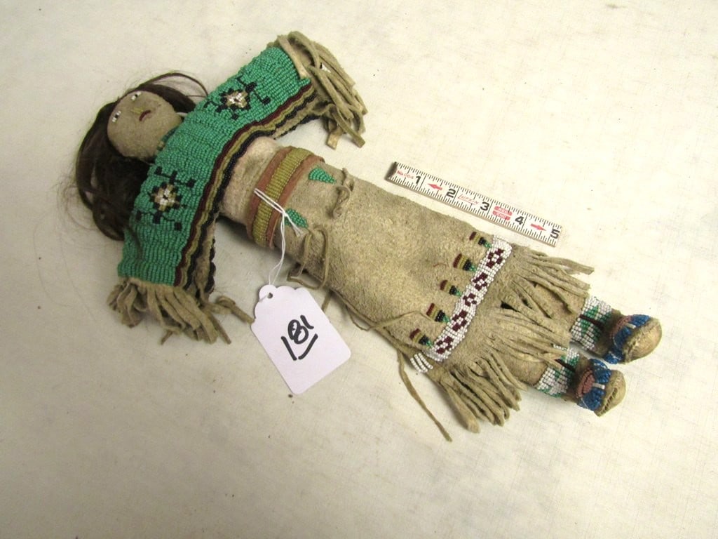 Bead doll: Plains 15" brain tanned and besded doll, human hair, fringe, sinew sewn, good to very good condition,