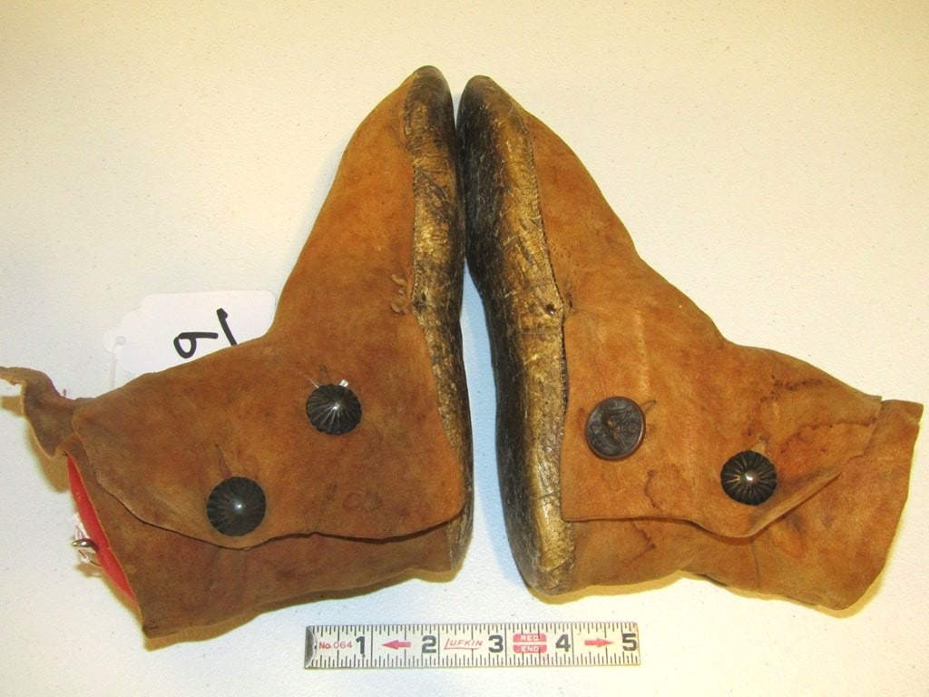 Moccasins: Pr Navajo 9" hide moccasins with authentic silver buttons, parfletch soles for cactus, good condition