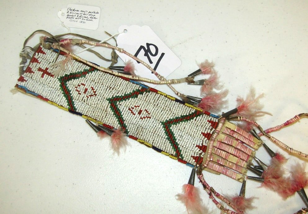 Hair drop: Cheyenne bead and quilled hair drop on parfletch, sinew sewn, quilled tassels, tin cones and feathers, good condition