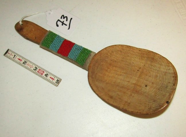 Ladle: 12 1/2" wood carved ladle with partial hide beaded handle, sinew sewn, good condition,