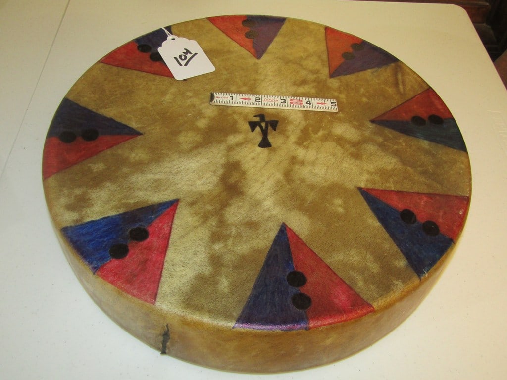 Drum: Large painted 16 X 3 1/4" drum with painted Thunderbird, heavy sinew sewn, very good condition
