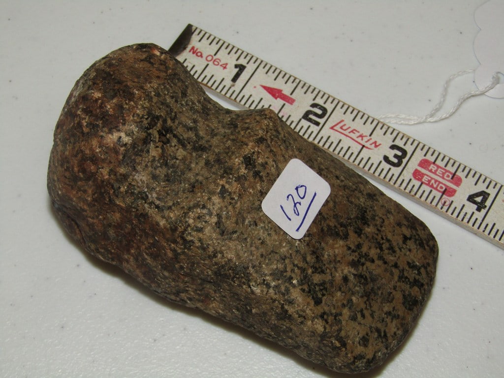 Axe: 3 7/8" brown speckled axe, 3/4 groove, not examined for coa