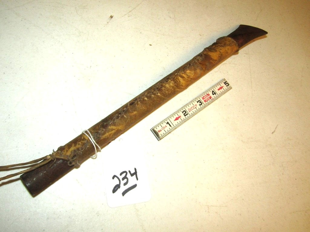 Hide tool: 13 3/4" sinew sewn hide cover over iron pipe, flattened end for scraper or tool, Beranek collection, good condition