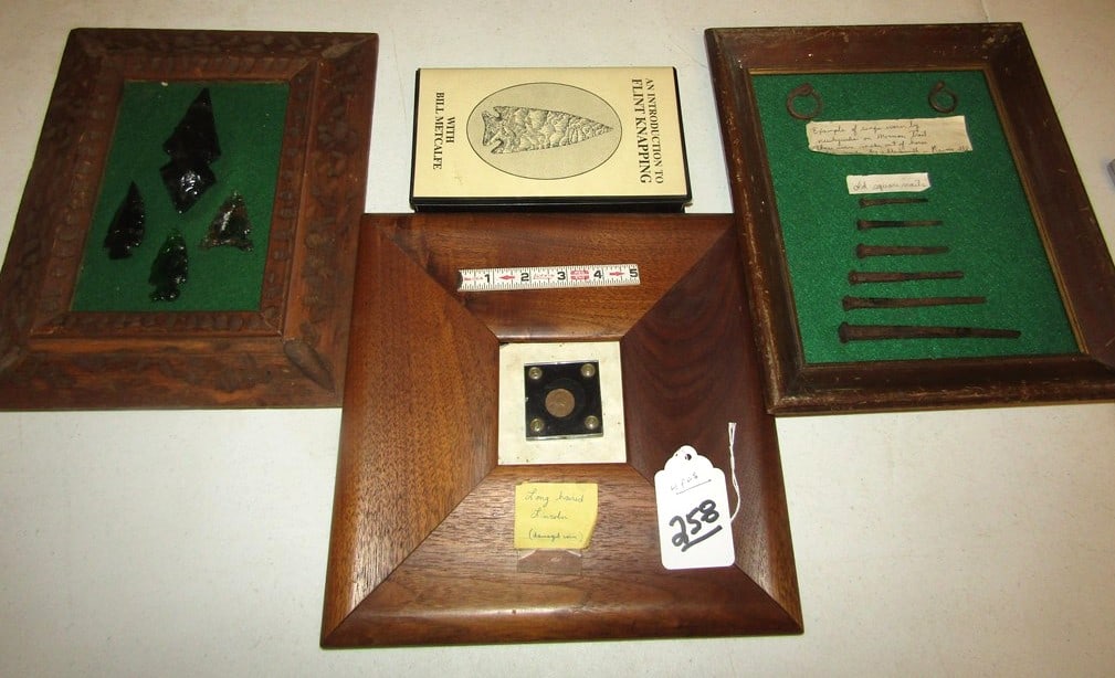 4 pc misc: Box with 4 pc incl fake damaged Lincoln long hair 1944 D, square nails, flint video and frame of points