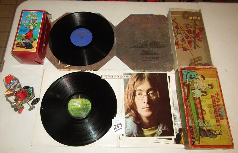 5 pc misc: 5 pc misc Beatle and Rolling stone albums, large like new Mexico textile 48 x 84",croquet game, Duck on Bike works good,
