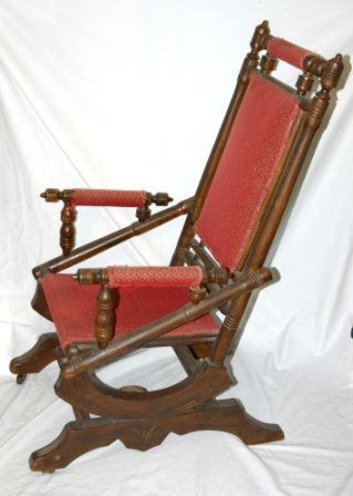 Early Dexter Rocking Chair. Original maroon uphol