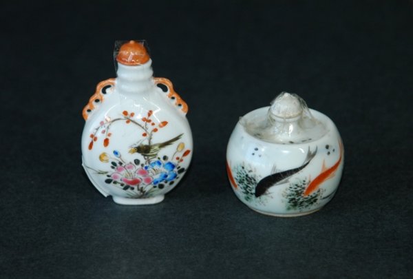 2 Oriental Painted Porcelain Snuff Bottles. Older: 2 Oriental Painted Porcelain Snuff Bottles. Older, squat style with fish; & enamelled floral & bird decoration. H 5cm & H 7cm