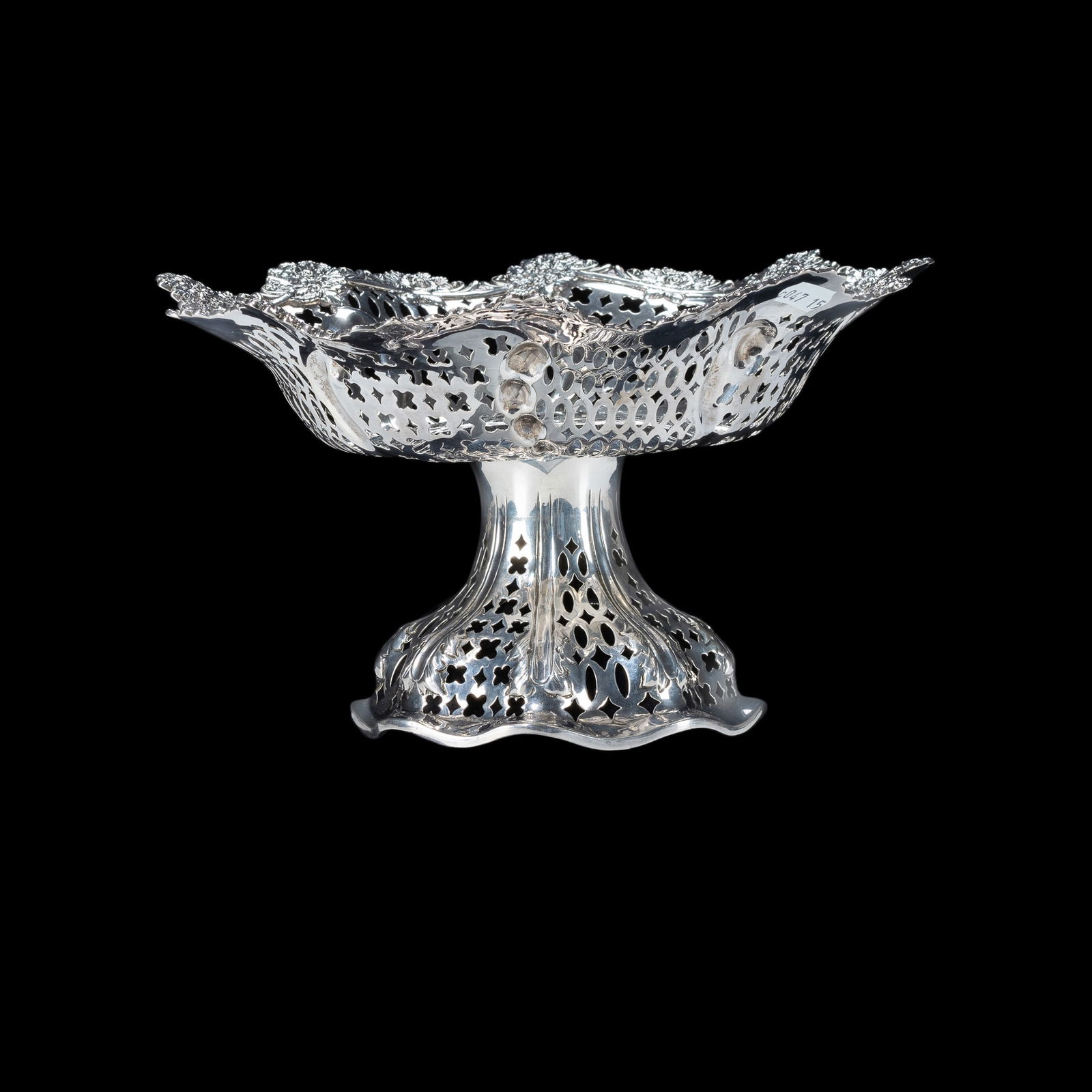 Victorian Sterling Silver Comport. HM London 1890, Charles Stuart Harris. Pierced bowl with cast: Victorian Sterling Silver Comport.HM London 1890, Charles Stuart Harris. Pierced bowl with cast border decorated with flowers. Shaped circular foot, pierced.(H13cm Dia.22cm W485g)