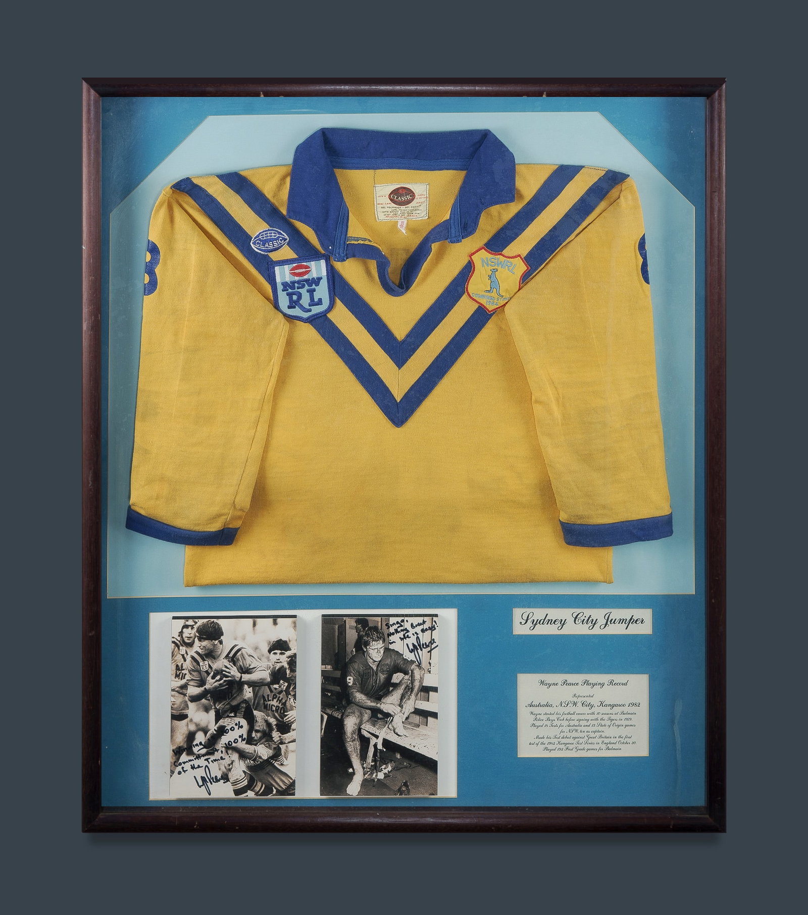 Wayne Pearce 1984 City Rugby League Jersey: Wayne Pearce 1984 City Rugby League Jersey Worn by Pearce during the 38–12 victory over Country in 1984. Framed with 2 signed photographs of Pearce. (95x80cm)