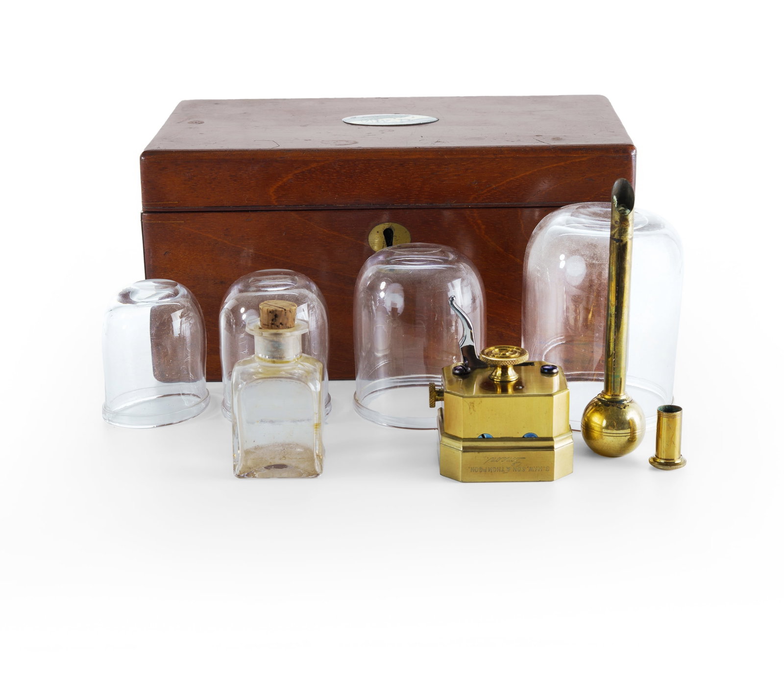 19th C Cupping Set: 19th C Cupping Set In fitted velvet-lined mahogany case, by S. Maw, Son & Thompson. Comprising scarificator, ball lamp, spirit bottle, and 4 graduated glass cups.