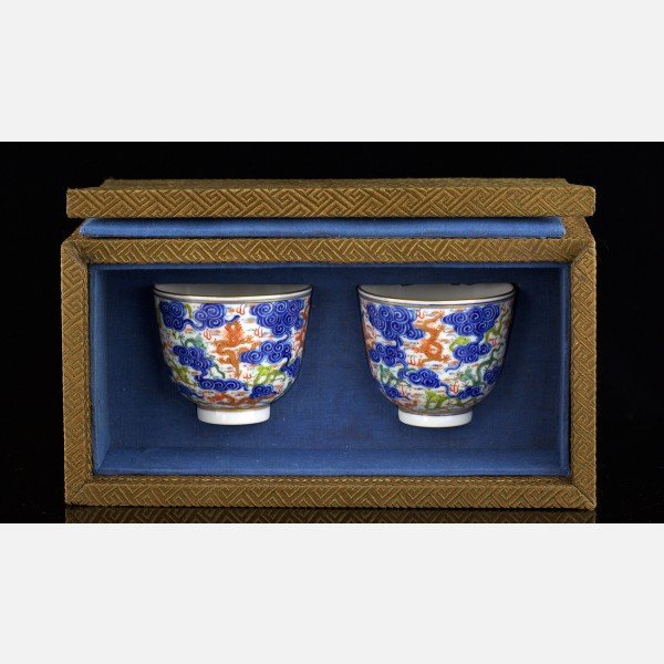 A Pair of Famille Verte and Blue and White Dragon Cups,: A Pair of Famille Verte and Blue and White Dragon Cups, Xuantong six-character underglaze-blue seal mark(1908-1911) Presented in original box, hand painted in famille-verte design, brightly decorated 