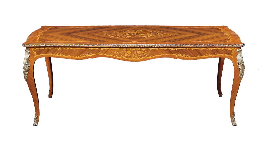 A rosewood and bois de rose table Italy, antique: finely inlaid in fruit woods with floral and vegetal patterns, shaped top, protection glass, two underlying drawers standing on shaped legs, chased and gilt bronze elements