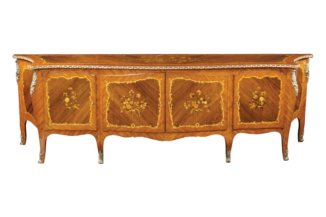 A rosewood and bois de rose cupboard Italy, antique: finely carved in fruit woods with floral and vegetal patterns, shaped top, four doors on the front, chased and gilt bronze elements