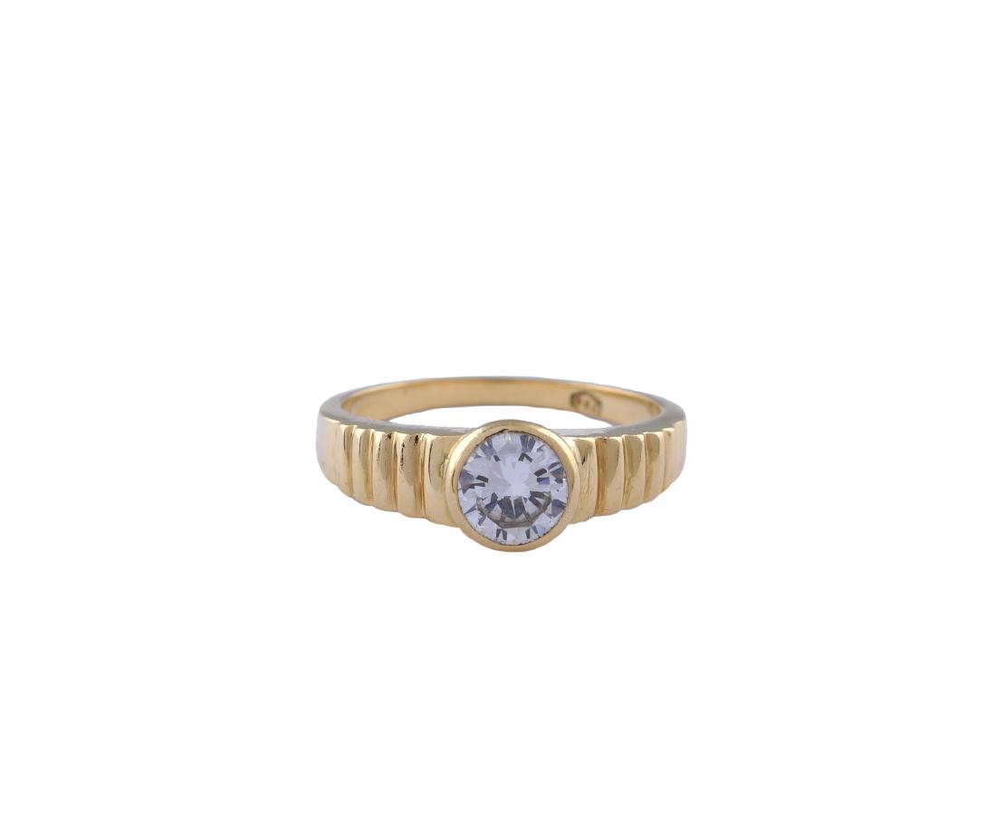 An 18kt gold ring with a diamond peso 6 gr. (1 of 2)