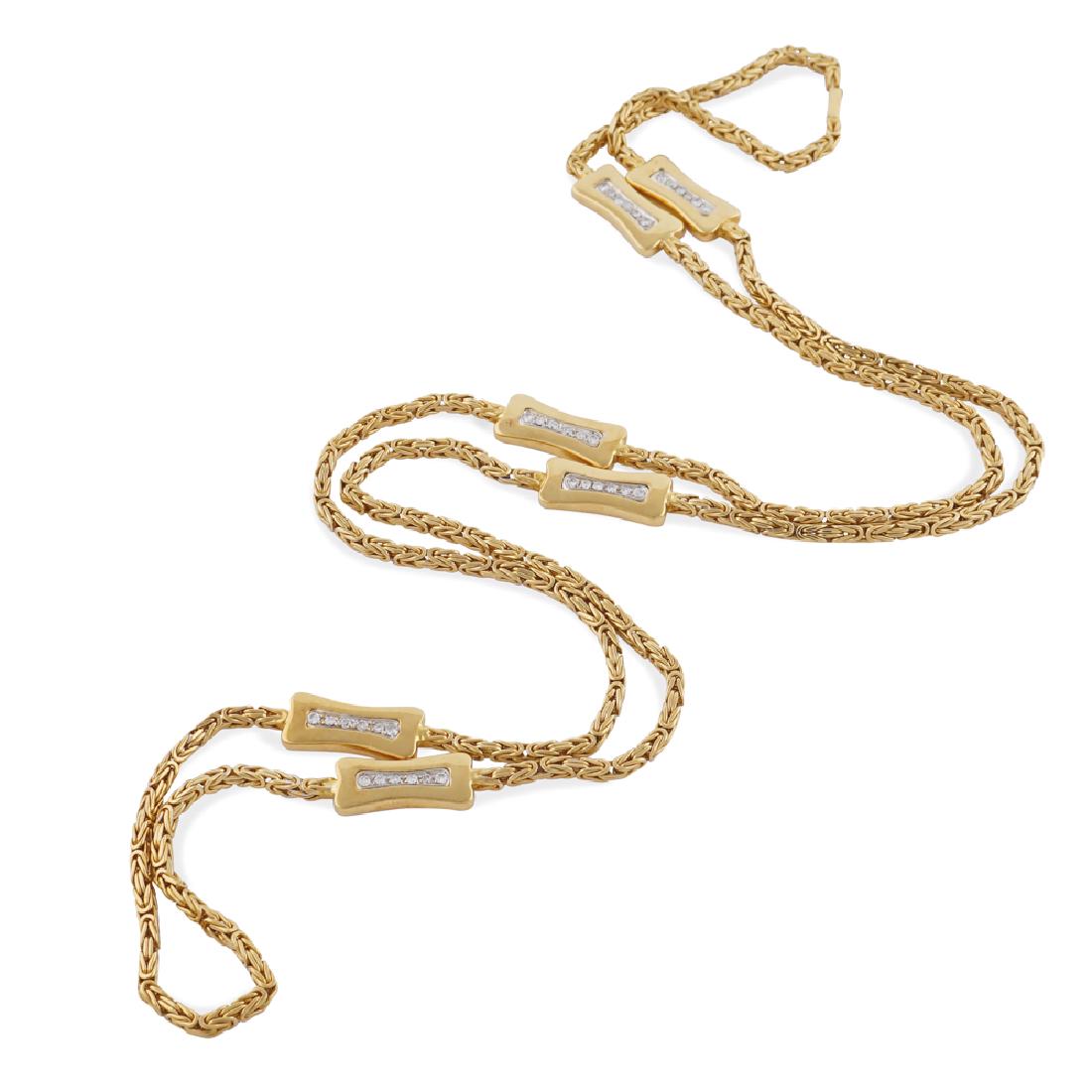 Chimento, 18kt gold necklace peso 67 gr.: tubular mesh alternated with six rectangular elements in yellow and white gold with brilliant cut diamonds about 0.60 ct riviere, signed on the closure, length 86 cm.