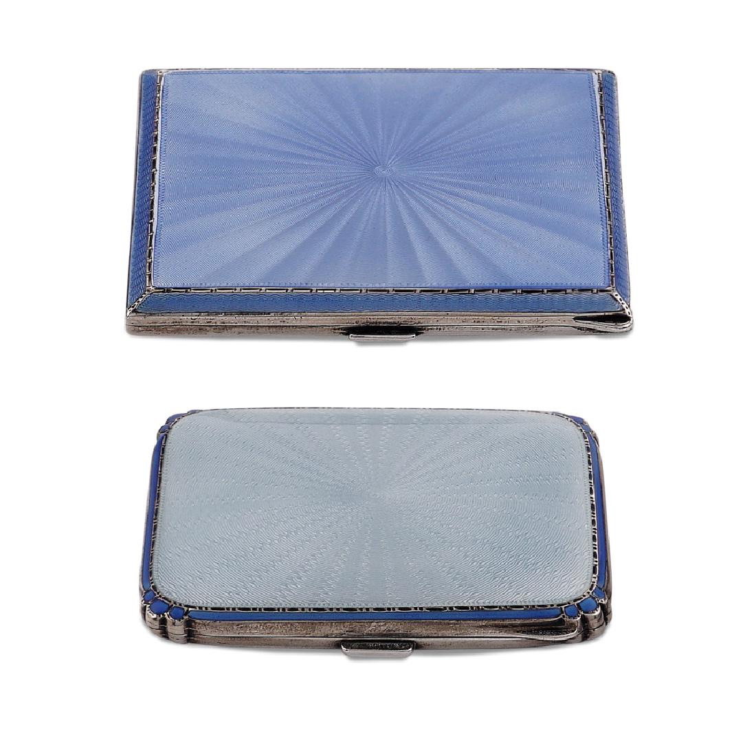 Two silver and enamel sigarette boxes: England, 20th century tot. weight 190 gr., a) rectangular shape, lid in guillochè enamel in pale blue shade, London 1936, 8x7,5 cm. b) rectangular shape, lid in guillochè enamel in blue shade, Birmi