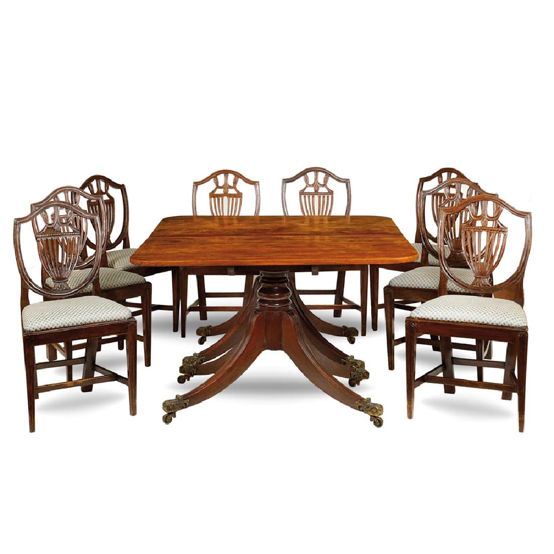 Mahogany table and eight chairs: Mahogany table and eight chairs, tabletop resting on two wood supports feet with giltbronze ending proving by wheel chairs with carved seatback sit covered by fabric slight defects, England 19th centu