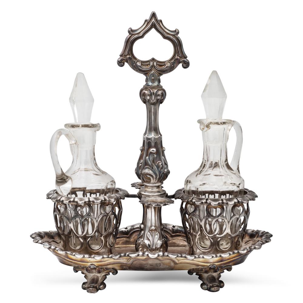 Silver cruet France, early 20th century 31x28x16 cm.: Silver cruet France, early 20th century 31x28x16 cm. marks of Alphonse Debain, Paris, pierced body with vegetal motifs, complete with two glass ampoules (different manufacture), weight 563 gr.