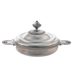 Circular silver legume dish: Paris, early 20th century, 16x32x22 cm., finely chiseled with vegetal motifs, podded profile, marks of Robert Linzeler active between 1872 and 1941, territorial and silversmith's marks under the base,