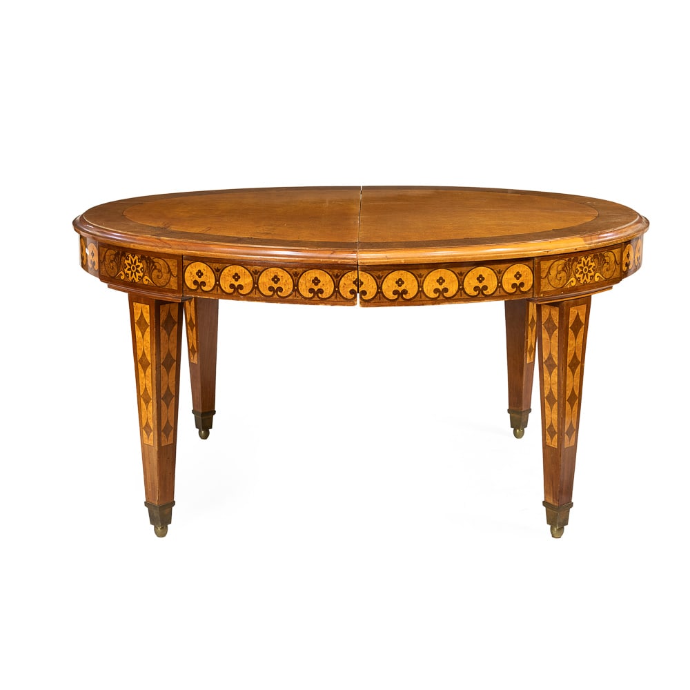 Dining table and eight chairs: France, 19th century, table 76x148x124 cm. - chairs h. 95cm., table inlaid with vegetal and geometric motifs, oval top resting on four legs with bronze terminals, complete with four 40 cm extensions,