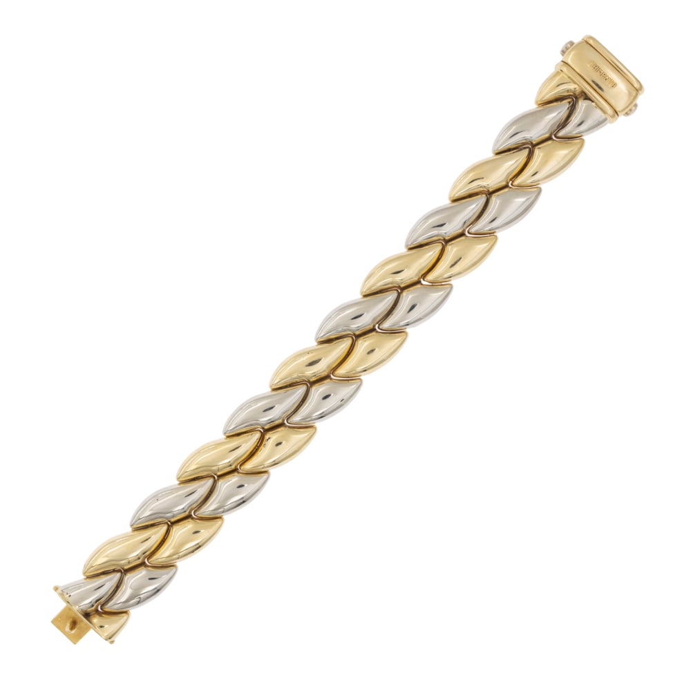 Chimento: Reversible bracelet with geometric motif, signed, weight 68 gr., on one side in 18kt yellow gold and on the other in 18kt yellow and white gold, length 20 cm.