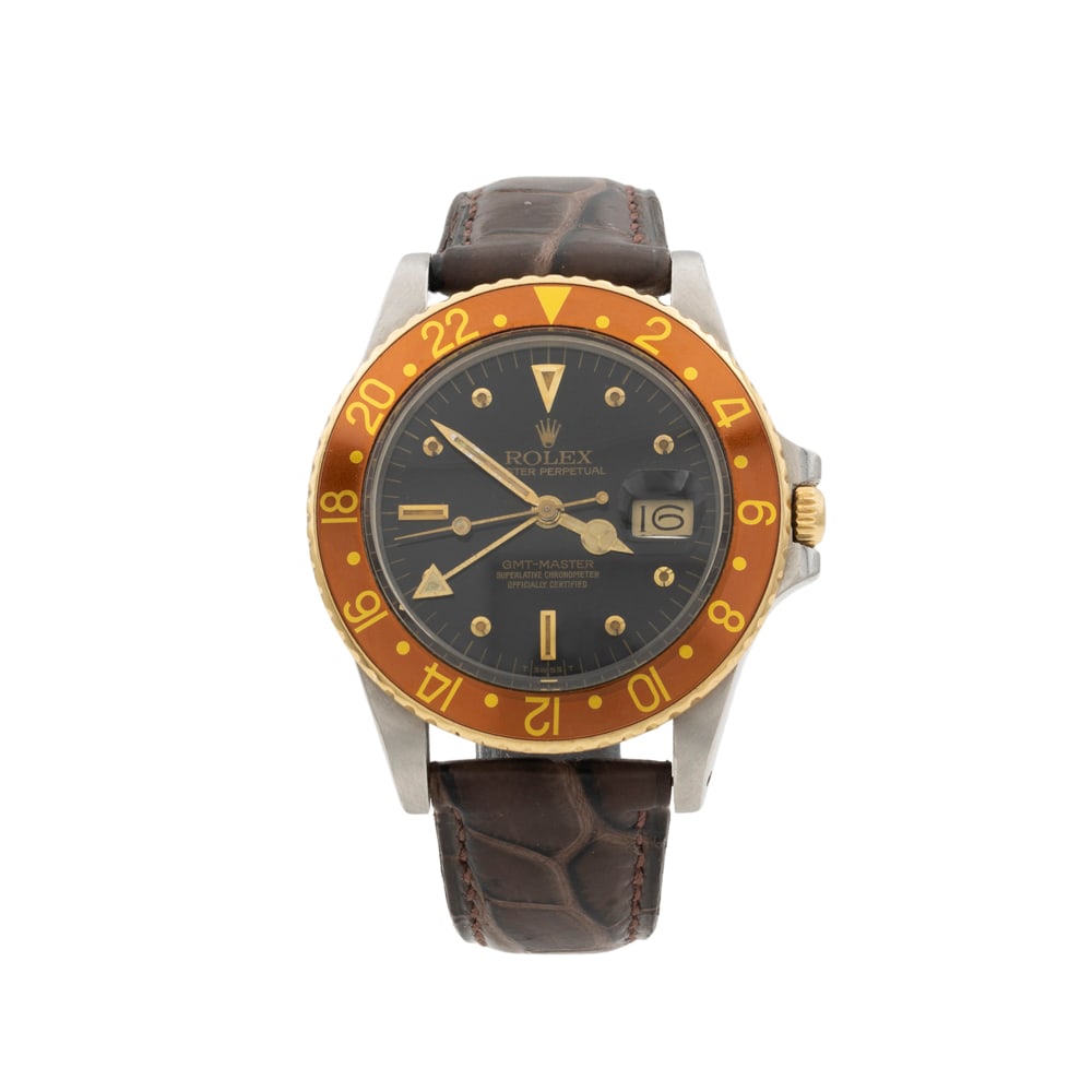Rolex: Gmt Master Oyster Perpetual Date vintage wristwatch, 1980s, , in steel and yellow gold, ref. 16753 - 943124, 40 mm case. black dial with indexes, date display at 3 o'clock, plastic glass, rotating bez